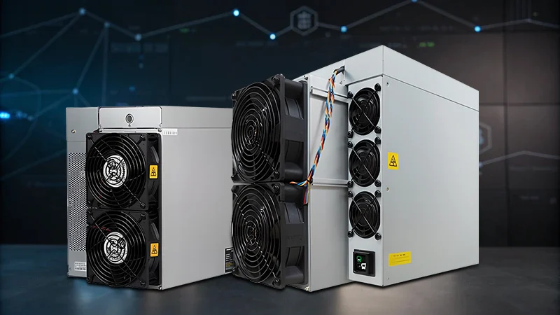 Two Antminer mining rigs on a dark surface with digital cryptocurrency background